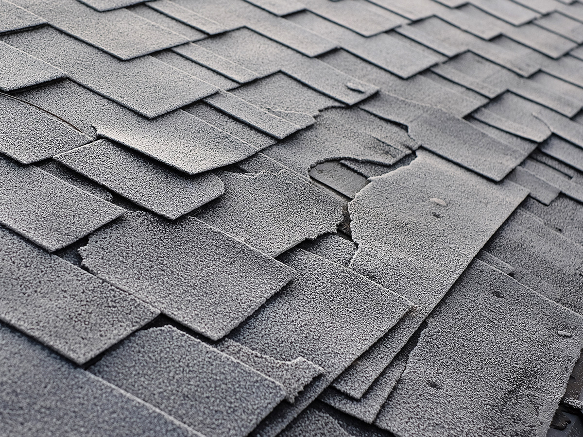 Old damaged roof shingles