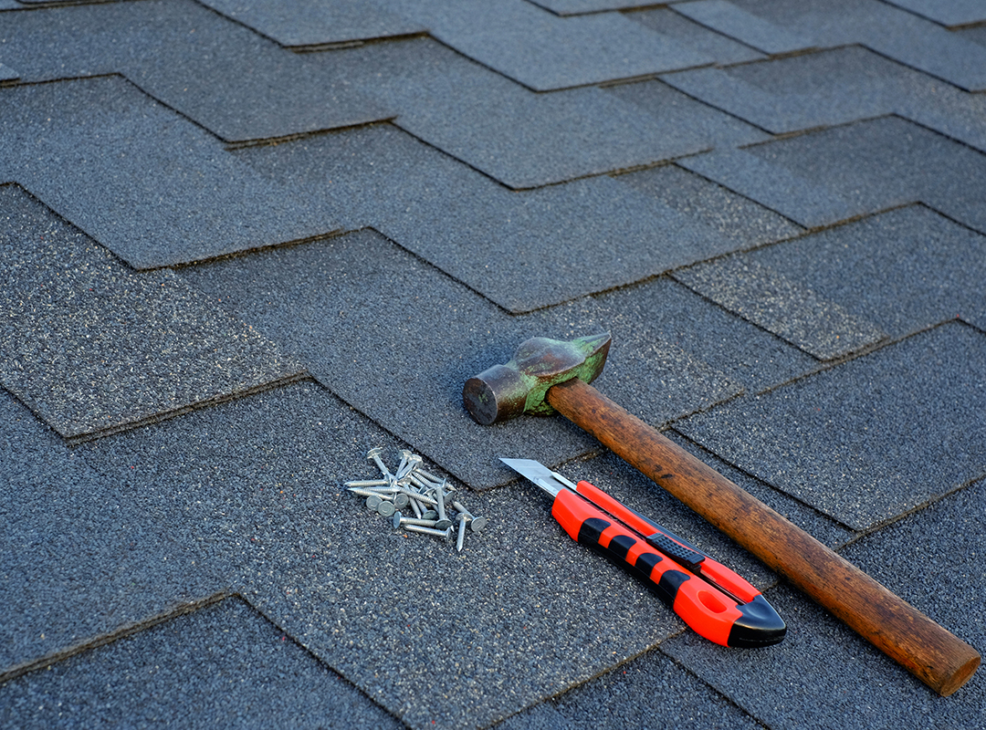 Roofing tools on shingles
